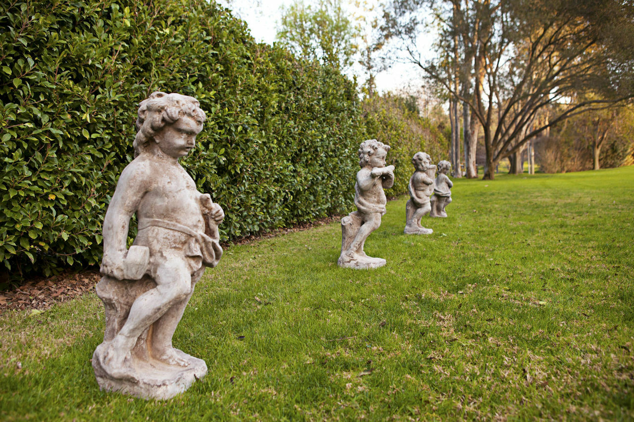 Cherub Sculptor Statue