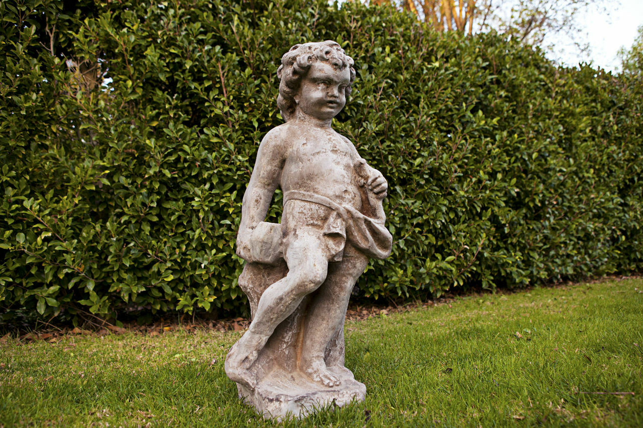 Cherub Sculptor Statue